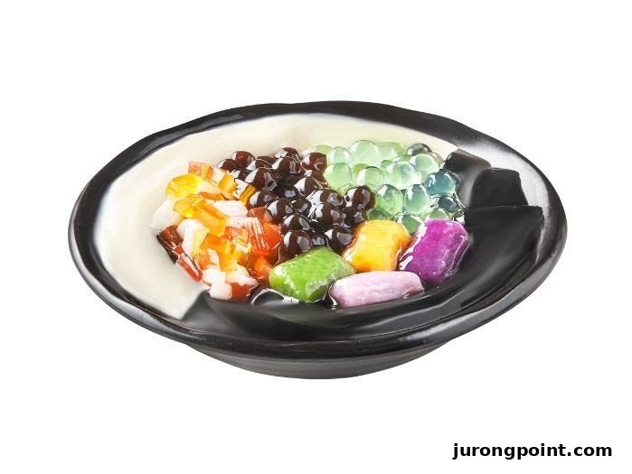 A vibrant bowl of Taiwanese dessert featuring various toppings like pearls, jellies, and taro balls.