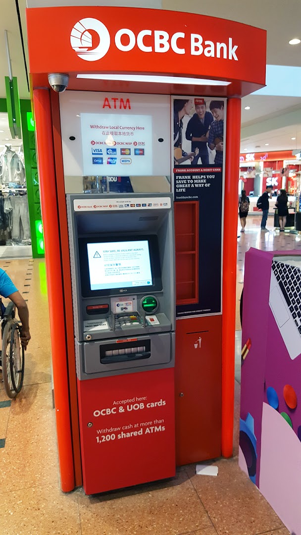 An OCBC Bank ATM located within a shopping mall, offering cash withdrawal services.
