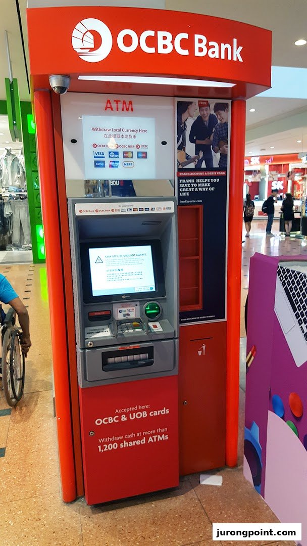 An OCBC Bank ATM located within a shopping mall, offering cash withdrawal services.