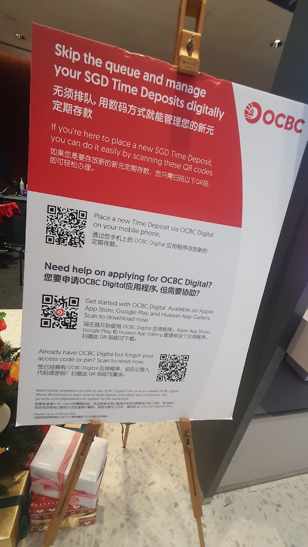 A sign at OCBC Bank promoting digital banking services for SGD Time Deposits and the OCBC Digital app.