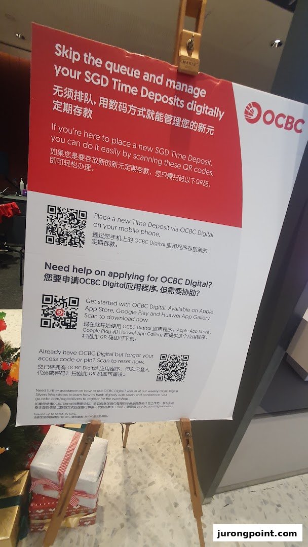 A sign at OCBC Bank promoting digital banking services for SGD Time Deposits and the OCBC Digital app.