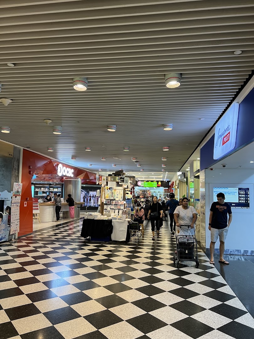 View of OCBC Bank entrance and a mall corridor with a checkered floor at Jurong Point.
