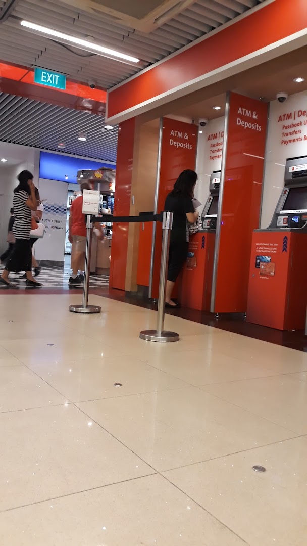 Customers utilizing OCBC Bank's ATM and deposit machines within the Jurong Point mall.