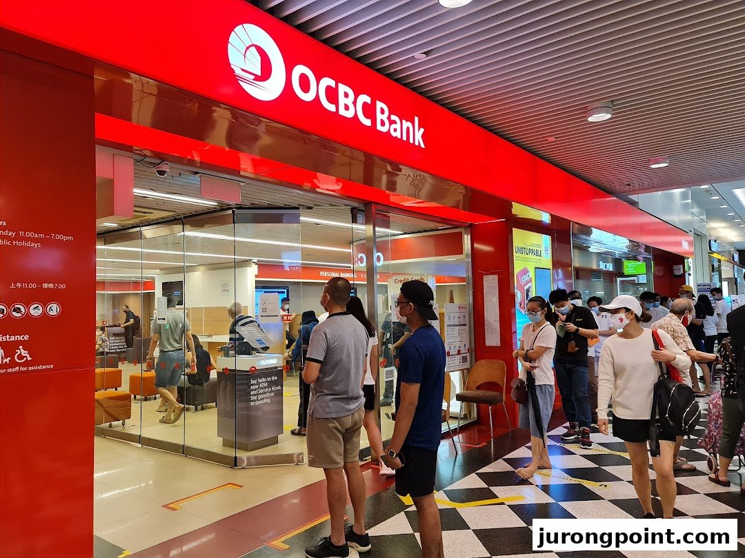 OCBC Bank branch entrance with customers queuing, showcasing banking services.