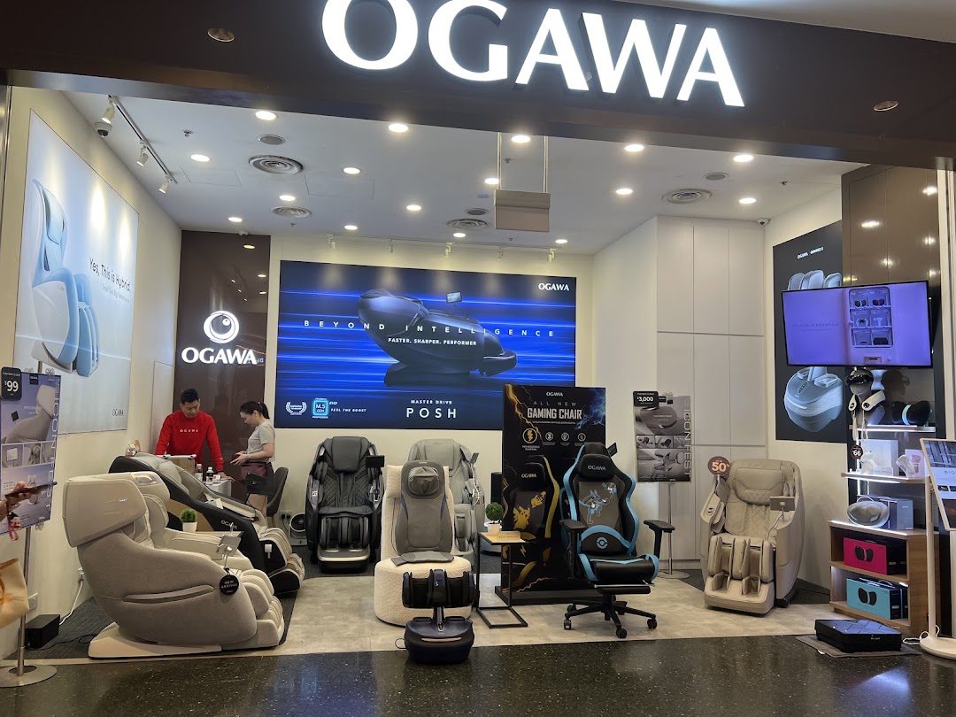 The OGAWA shopfront showcasing a range of massage chairs and wellness products, with staff assisting customers.