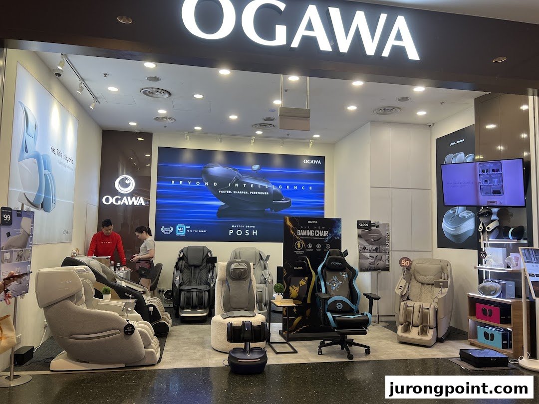 The OGAWA shopfront showcasing a range of massage chairs and wellness products, with staff assisting customers.