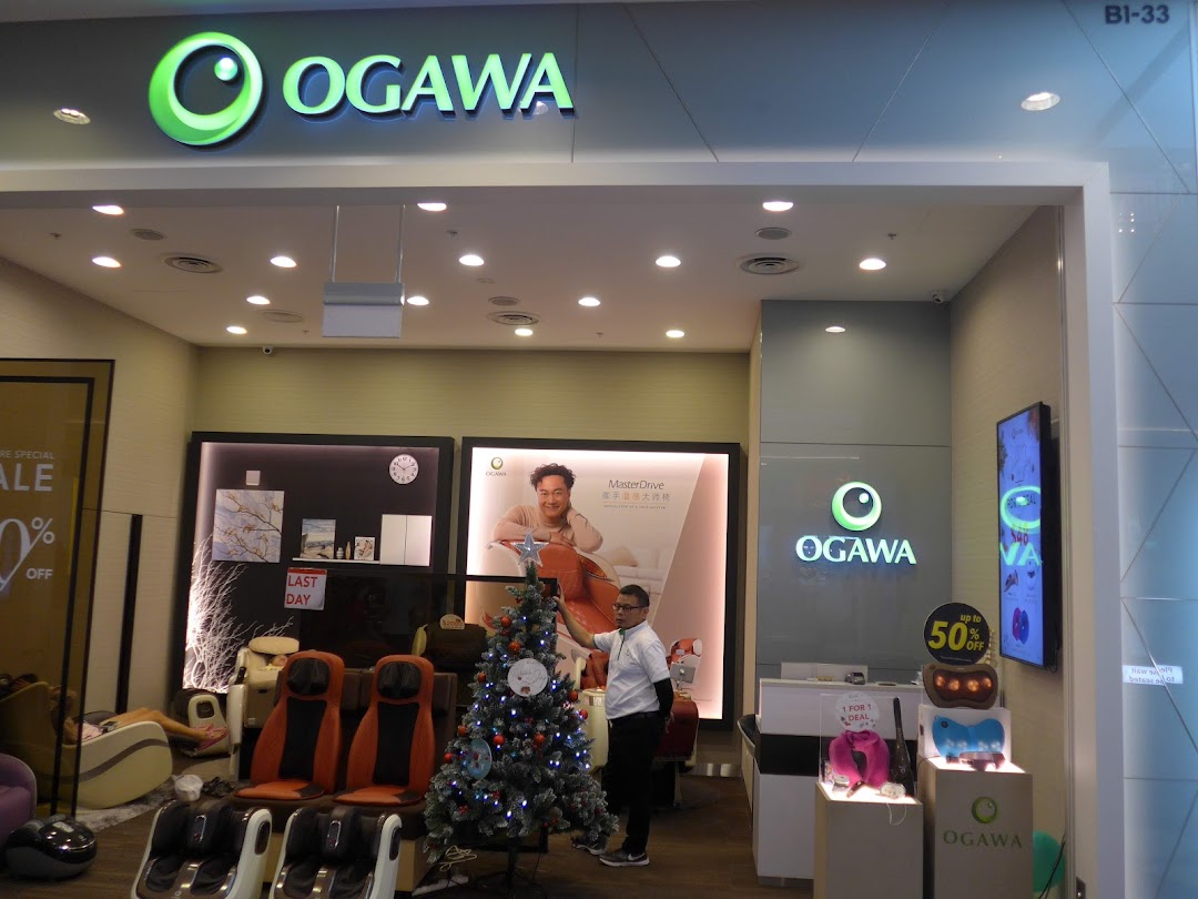 The OGAWA shop entrance showcasing massage chairs, wellness products, and festive holiday decor.