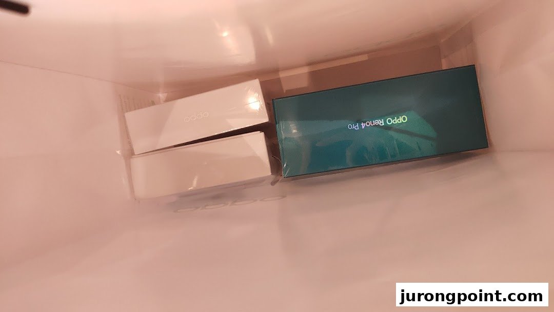 OPPO product boxes, including an OPPO Reno4 Pro, seen inside a shopping bag.