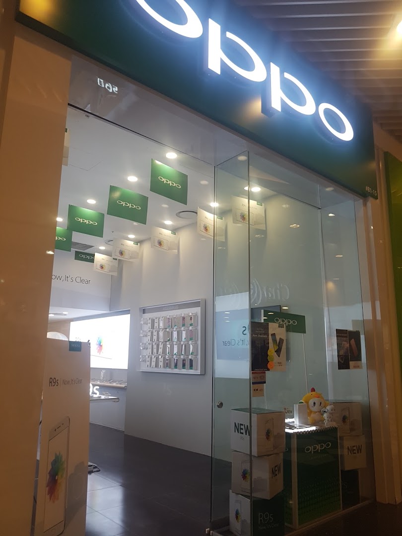 The brightly lit entrance of an OPPO Concept Store showcasing smartphones and accessories.