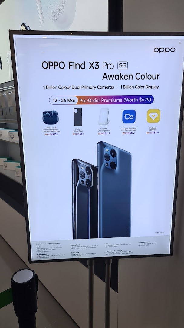 A bright digital display in an OPPO store showcasing the OPPO Find X3 Pro 5G and its pre-order premiums.