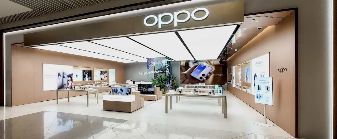 Interior view of a modern OPPO Concept Store showcasing smartphones, smart gadgets, and interactive displays.