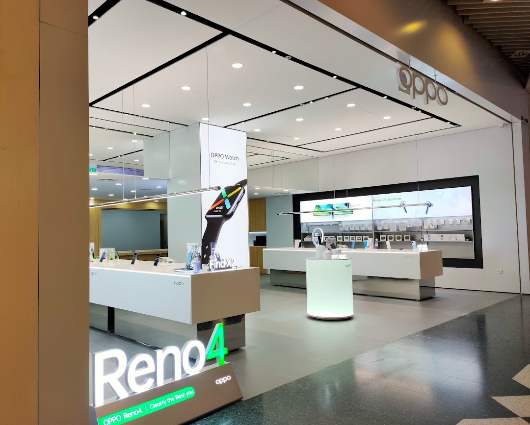 Bright, modern interior of an OPPO Concept Store showcasing smartphones, smartwatches, and accessories.