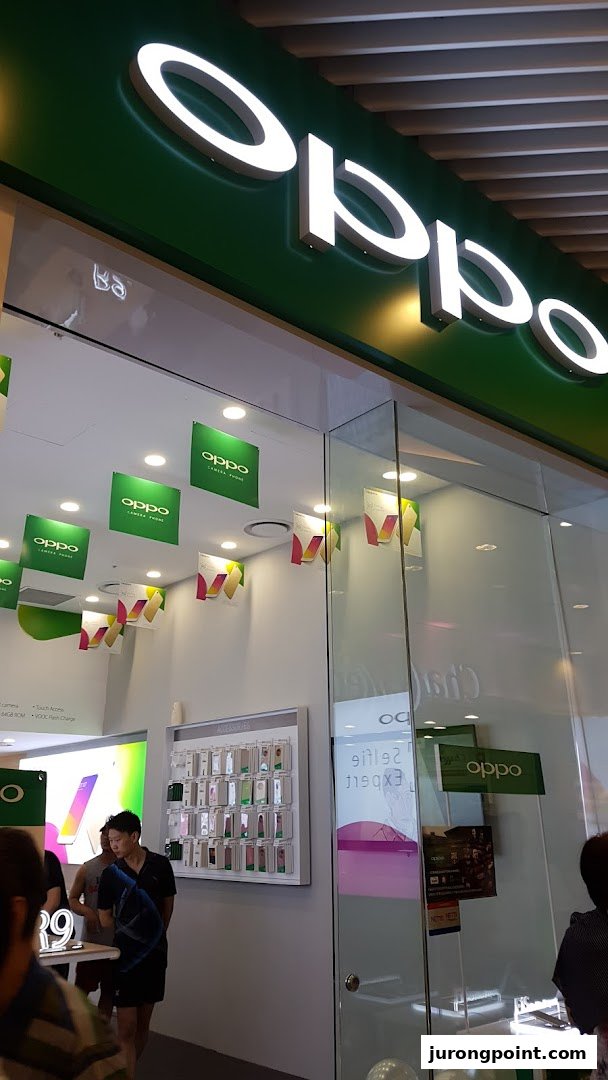 The entrance and interior of an OPPO Concept Store, showcasing mobile phones and accessories.