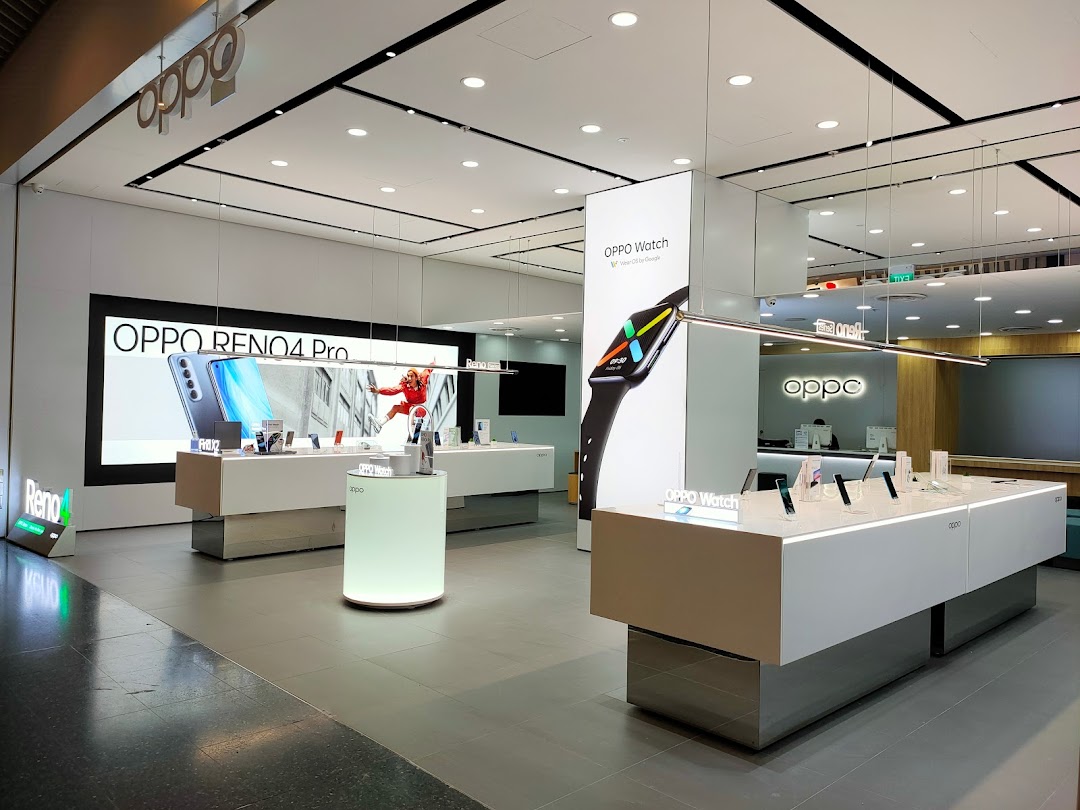 Modern OPPO Concept Store interior showcasing smartphones and smartwatches on sleek displays.