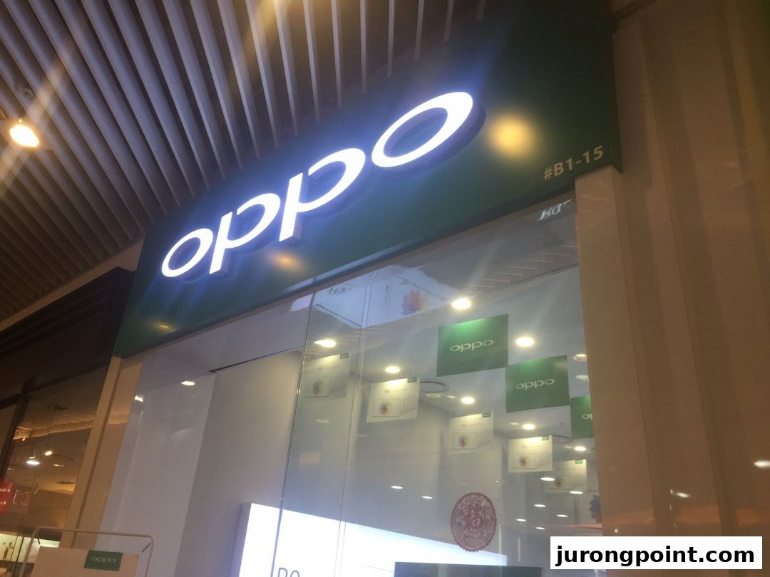 The illuminated OPPO Concept Store sign and glass entrance at a shopping mall.