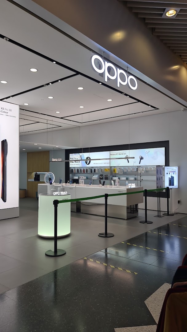 A bright, modern OPPO Concept Store interior showcasing the latest smartphones, smartwatches, and accessories.