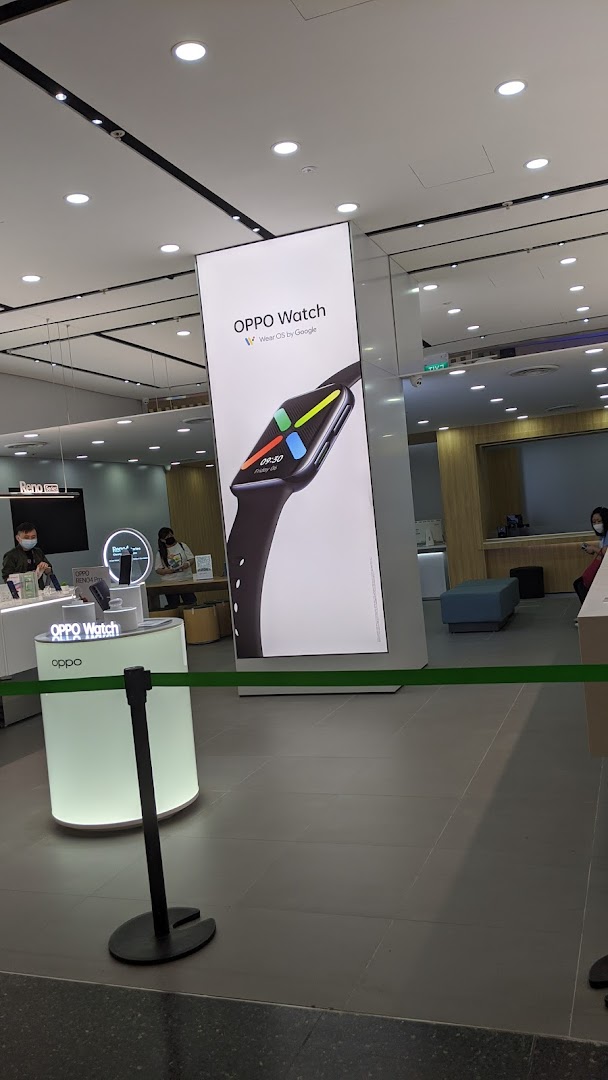 Interior view of an OPPO Concept Store featuring a large OPPO Watch display and product counters.