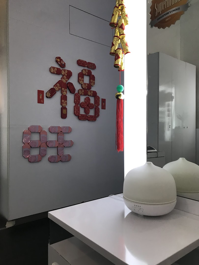 An interior shot of Oriental Hair Solutions featuring festive decorations and an aroma diffuser.