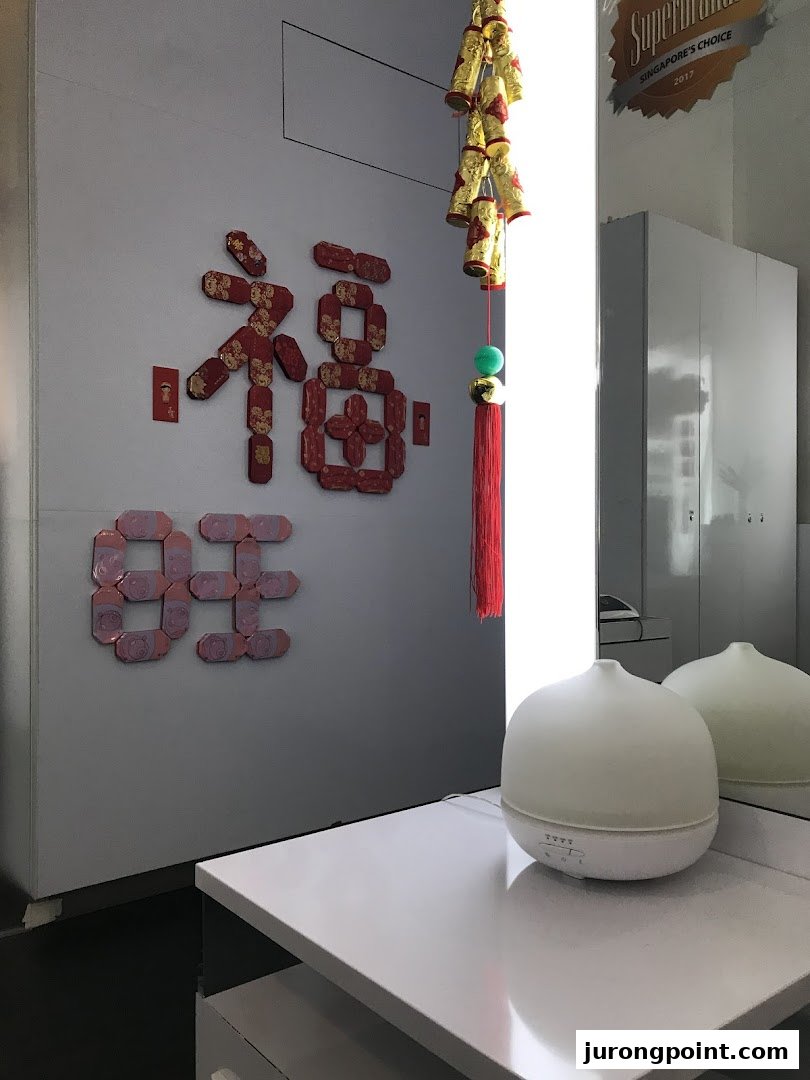 An interior shot of Oriental Hair Solutions featuring festive decorations and an aroma diffuser.
