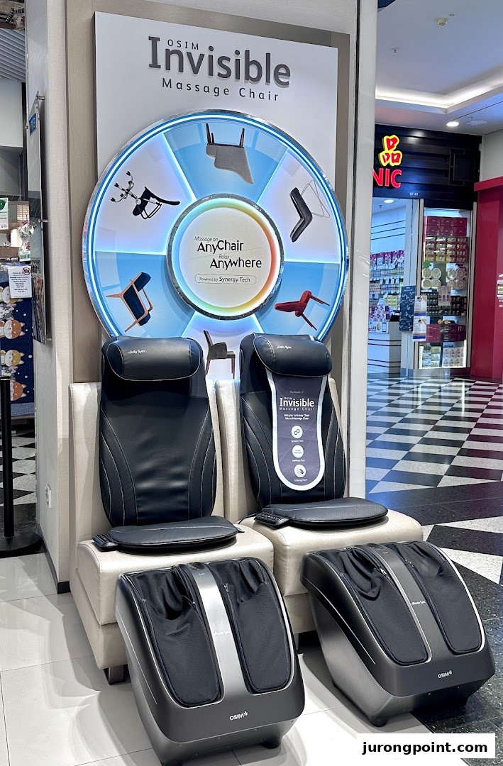 OSIM display featuring "Invisible Massage Chair" cushions and foot massagers.