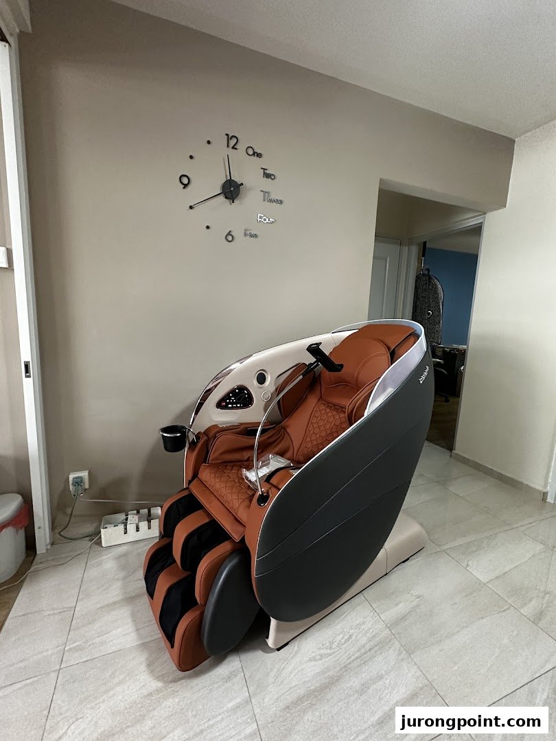A luxurious brown and black OSIM massage chair displayed in a modern setting.