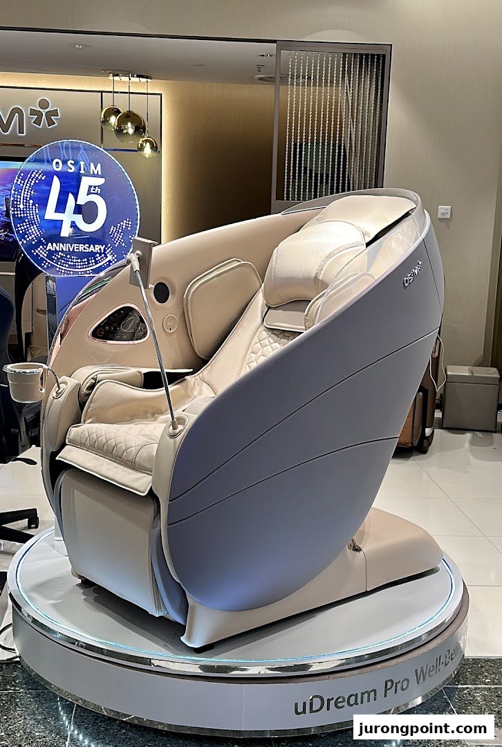A luxurious beige OSIM uDream Pro Well-Being massage chair on display.