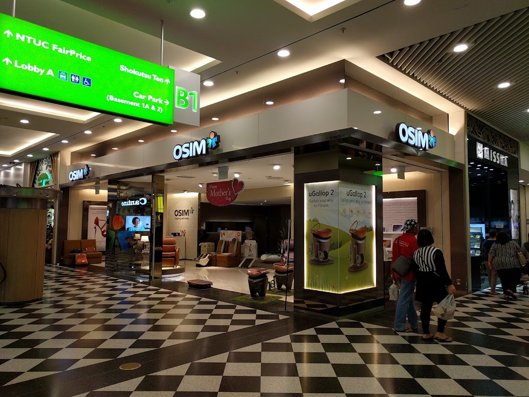 The OSIM store entrance showcasing massage chairs and wellness products in a modern mall setting.