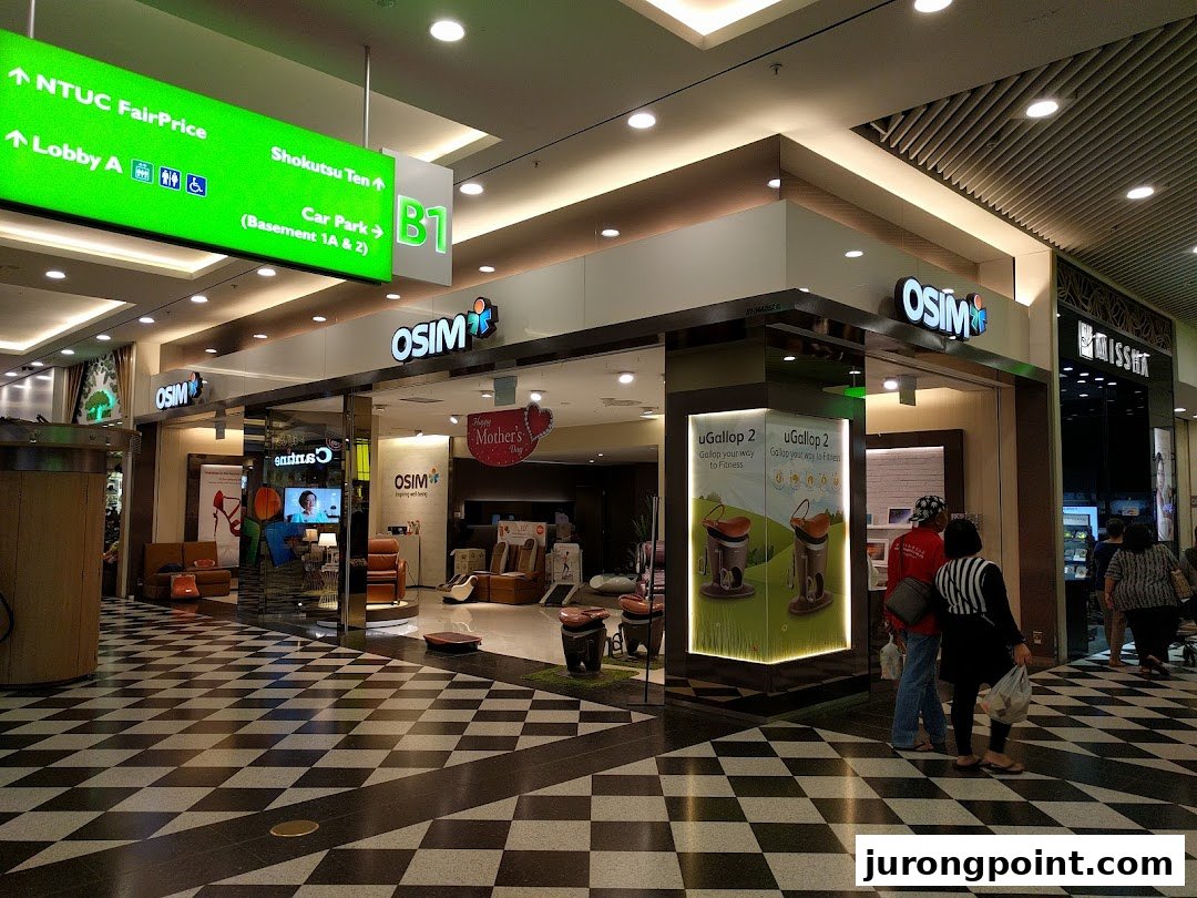 The OSIM store entrance showcasing massage chairs and wellness products in a modern mall setting.