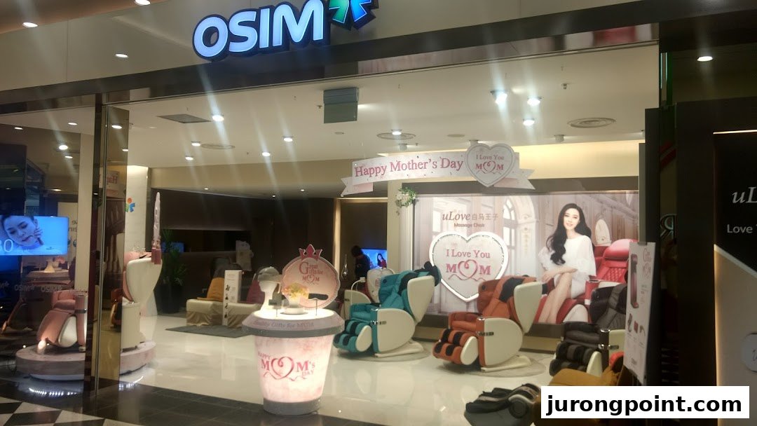 OSIM shop front displaying various massage chairs and Mother's Day promotions, inviting customers inside.