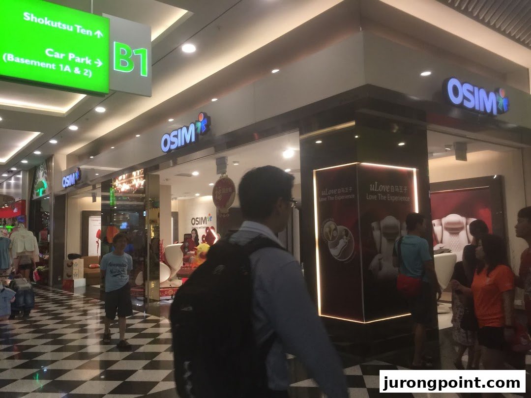 The OSIM store entrance in a bustling shopping mall, showcasing wellness products and inviting visitors inside.
