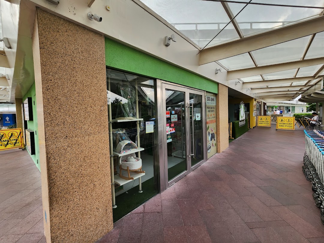 The storefront of Pets Station, showcasing pet supplies and accessories through its glass windows.