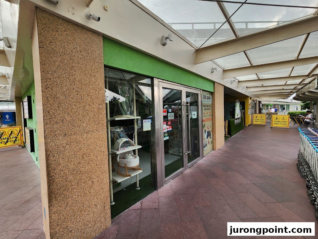 The storefront of Pets Station, showcasing pet supplies and accessories through its glass windows.