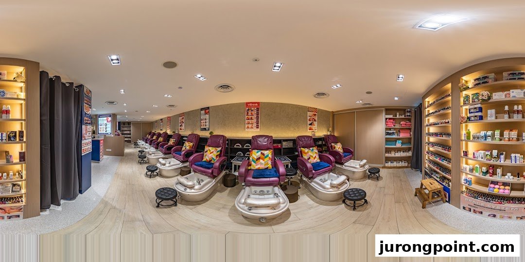 Interior view of a modern nail spa featuring multiple comfortable pedicure stations and extensive product displays.