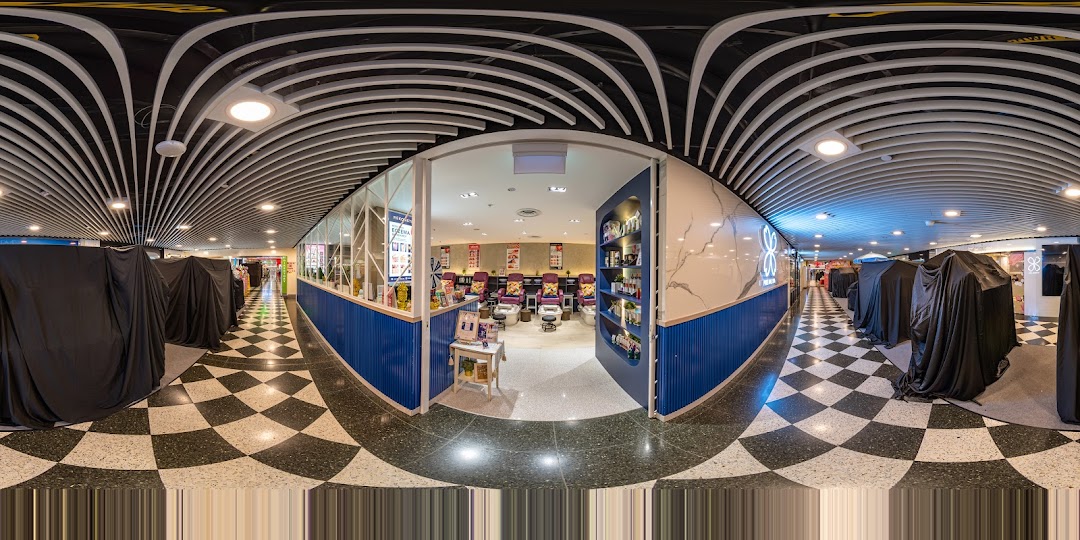 The inviting entrance of Pixie Nail Spa, showcasing comfortable pedicure chairs and a clean, modern interior.
