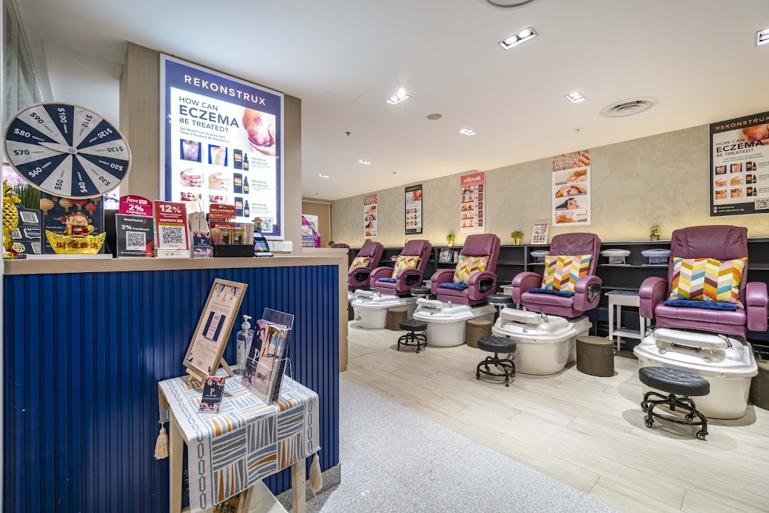 Interior view of Pixie Nail Spa, featuring comfortable pedicure chairs and a welcoming reception area.