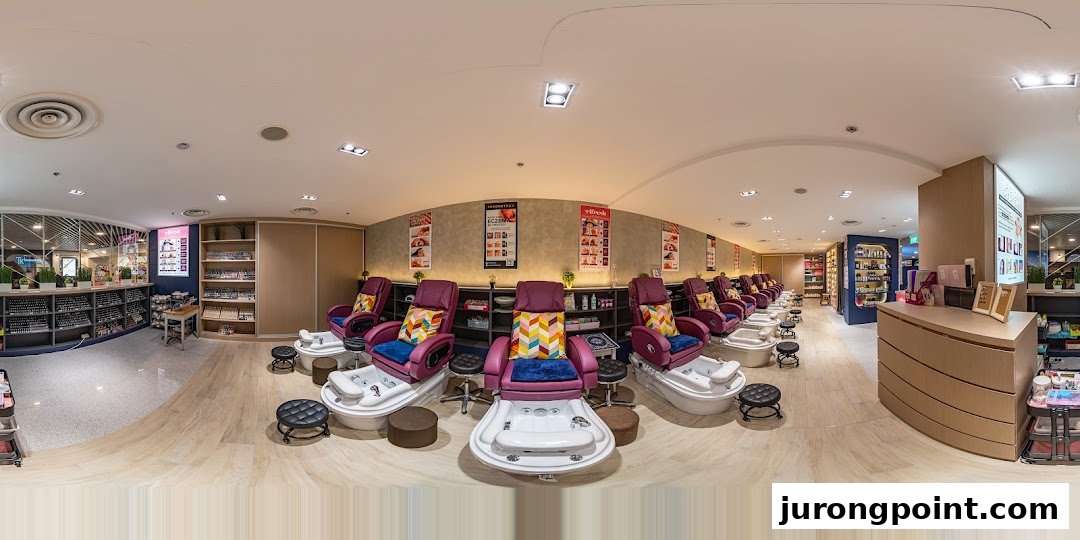 A panoramic view of Pixie Nail Spa's interior, featuring multiple pedicure stations and extensive nail polish displays.