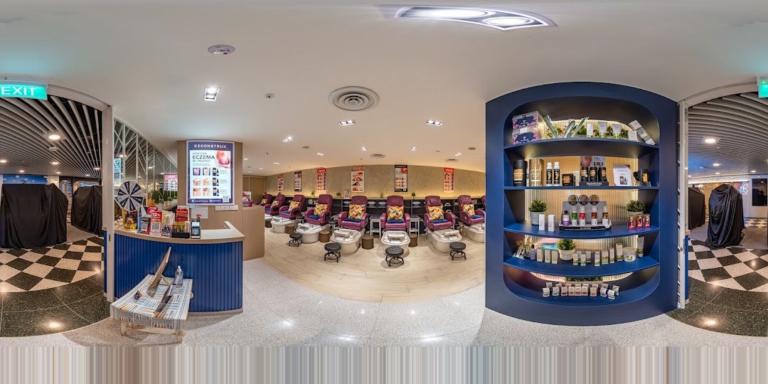 A panoramic view of Pixie Nail Spa's inviting interior, featuring pedicure stations, reception, and product displays.
