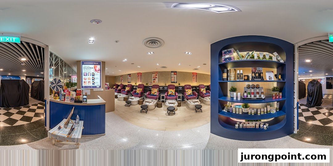 A panoramic view of Pixie Nail Spa's inviting interior, featuring pedicure stations, reception, and product displays.