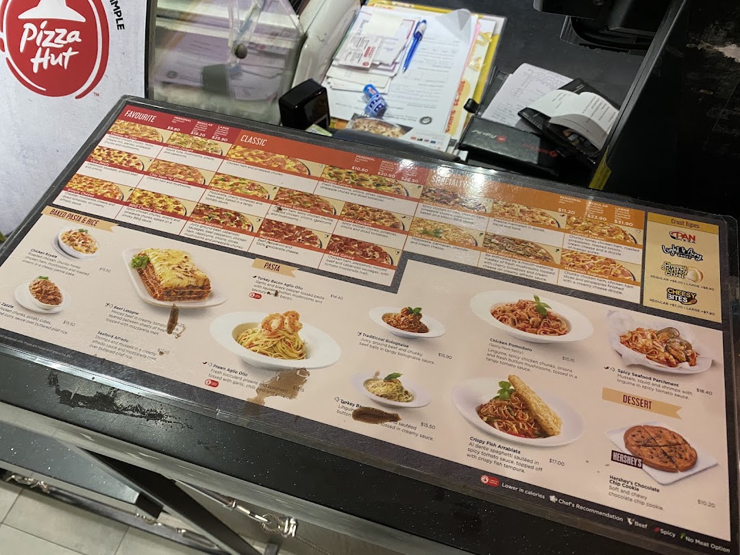 A detailed Pizza Hut menu displaying various pizza, pasta, and dessert options with prices.