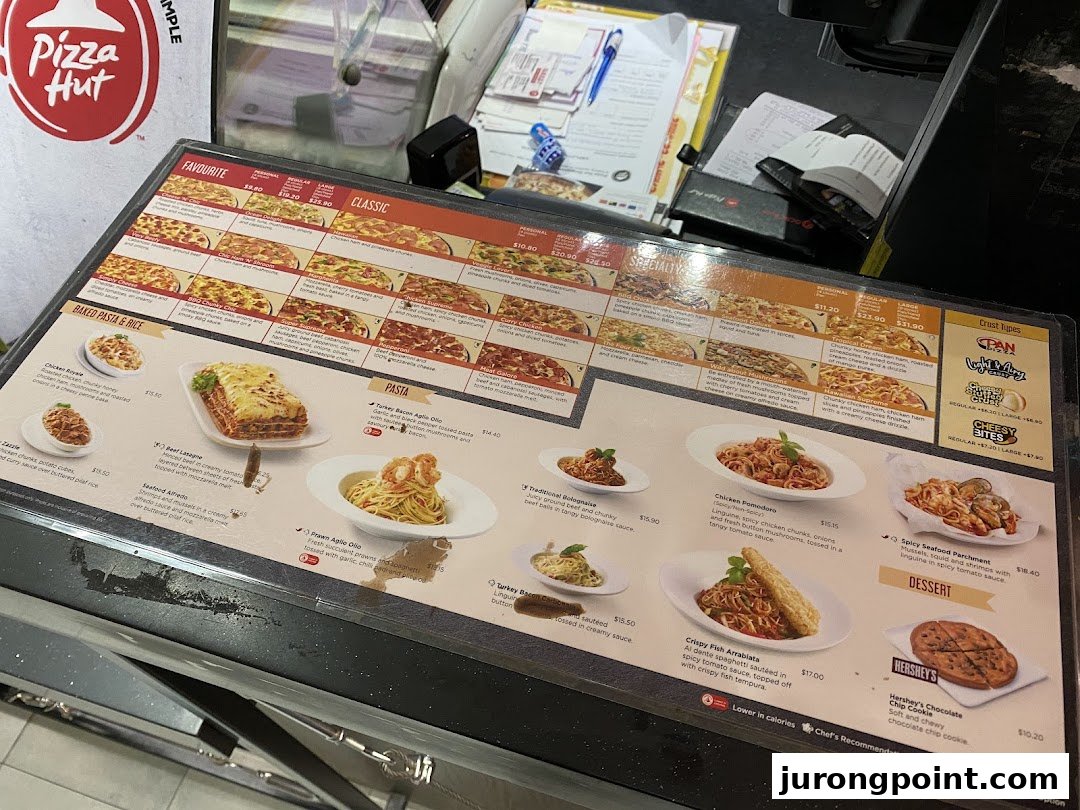 A detailed Pizza Hut menu displaying various pizza, pasta, and dessert options with prices.