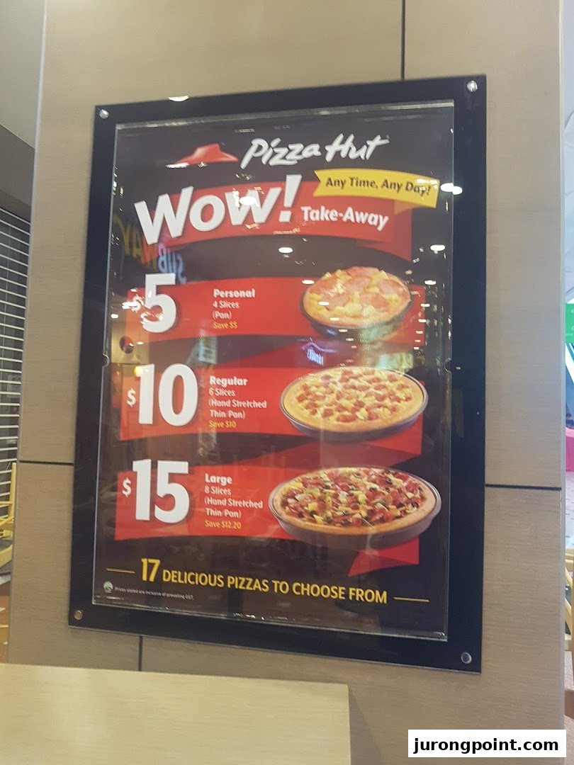 A Pizza Hut menu board displaying take-away pizza sizes and prices.