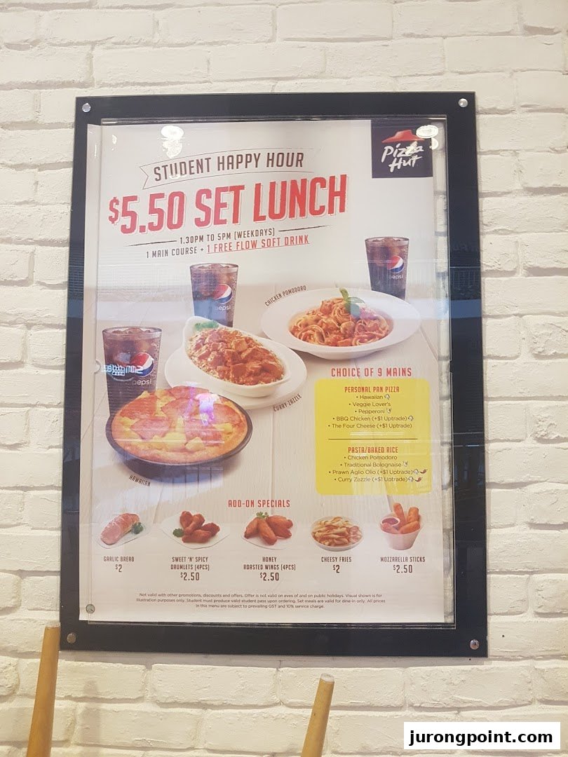 A Pizza Hut menu board displaying a 'Student Happy Hour' $5.50 set lunch offer with various main courses and add-ons.