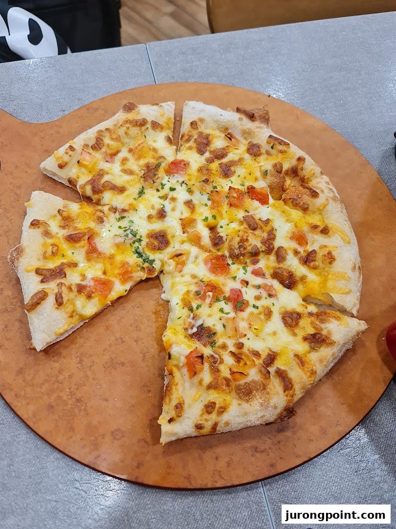 A freshly baked pizza with melted cheese and toppings, served on a wooden peel.