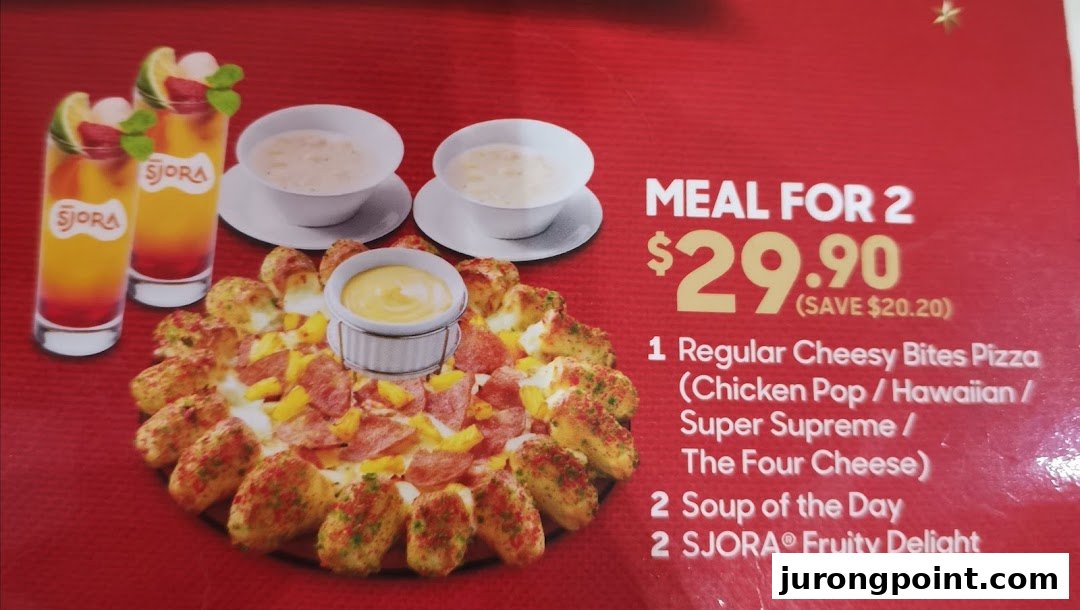 A Pizza Hut menu board displaying a 'Meal for 2' deal featuring pizza, soup, and drinks.