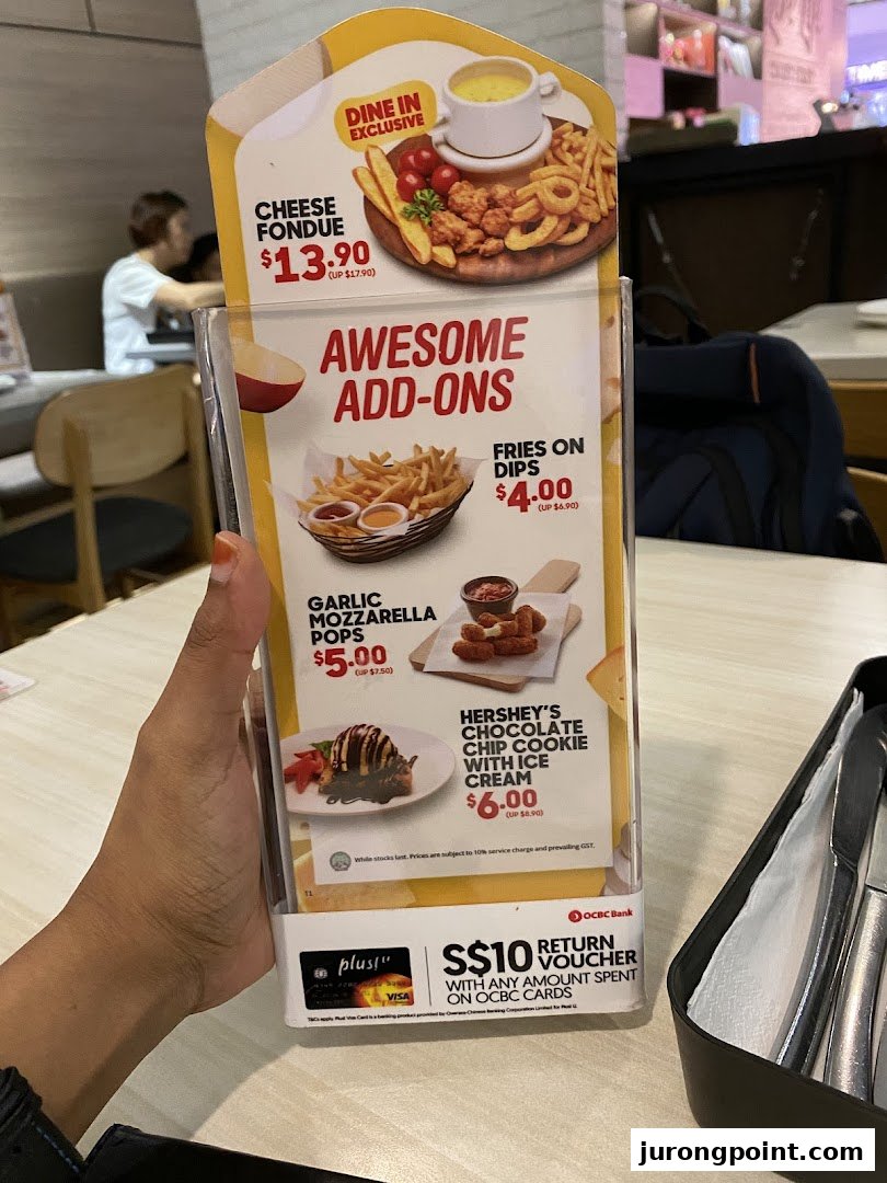 A close-up of a Pizza Hut menu stand displaying exclusive dine-in offers and awesome add-ons.
