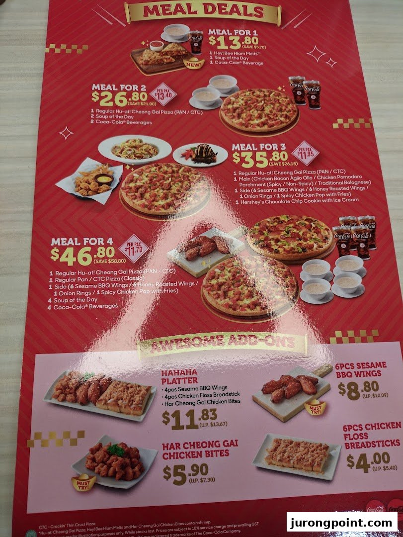 A vibrant red menu from Pizza Hut showcasing various meal deals and awesome add-ons.