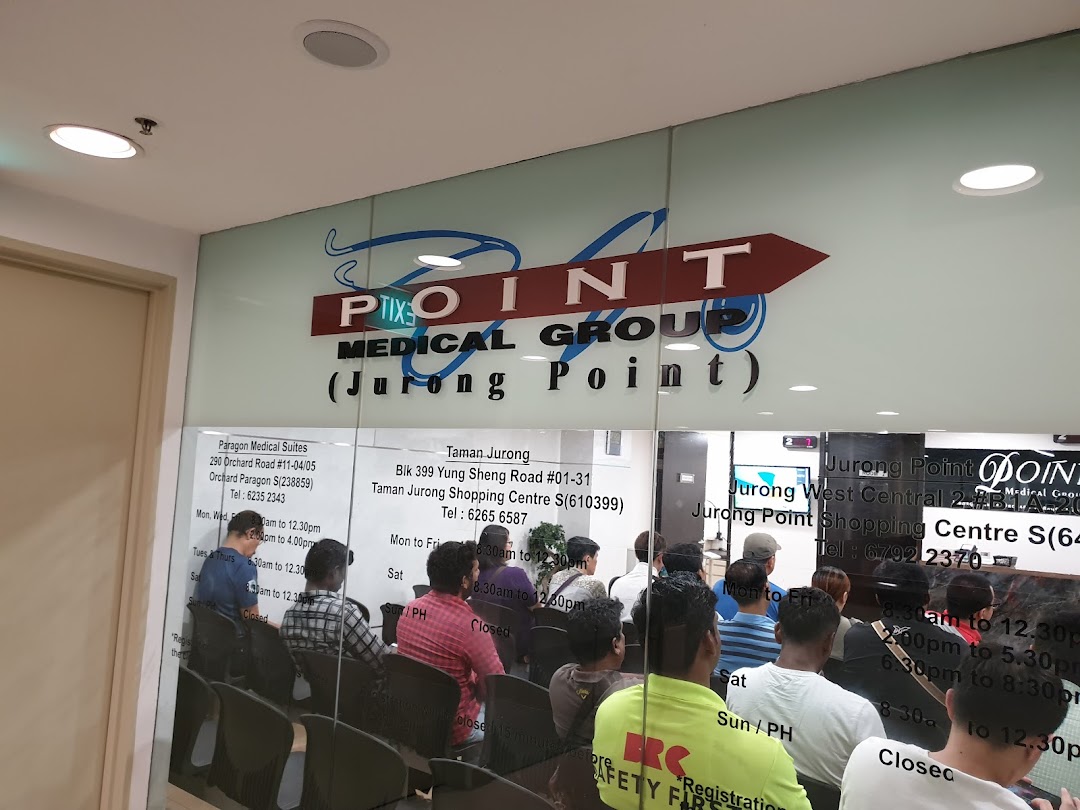 The entrance of Point Medical Group at Jurong Point, showing the waiting area and clinic details.