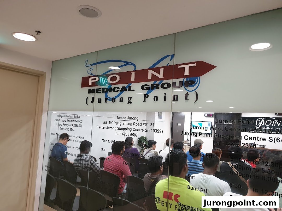 The entrance of Point Medical Group at Jurong Point, showing the waiting area and clinic details.