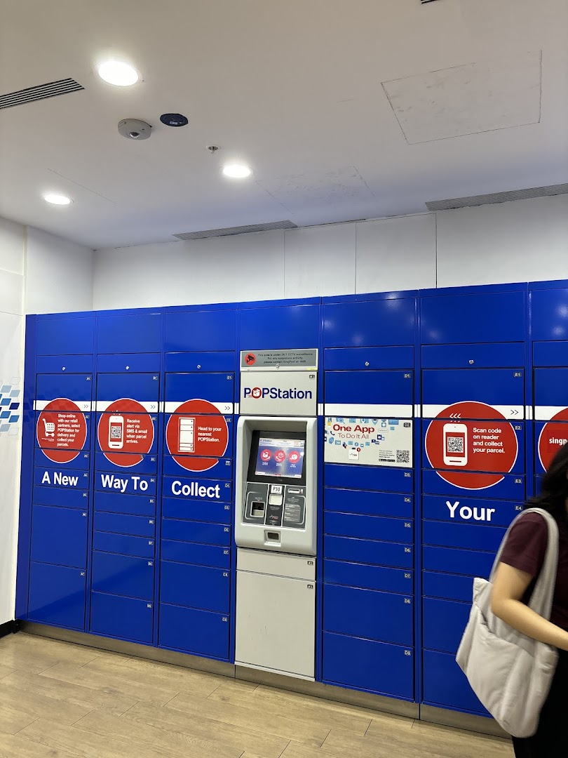 A POPStation parcel locker system with a central kiosk and blue lockers, offering convenient parcel collection.