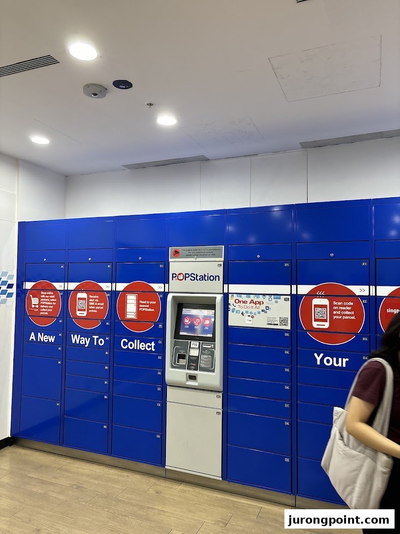 A POPStation parcel locker system with a central kiosk and blue lockers, offering convenient parcel collection.